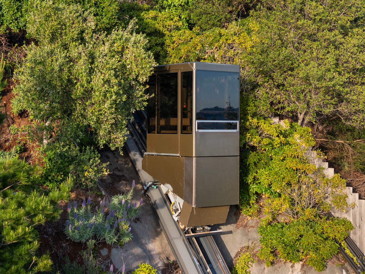 A Swiss-engineered inclined elevator carries guests from the gated street entrance to the home’s main level at 125 Belvedere Ave. on Belvedere Island.
